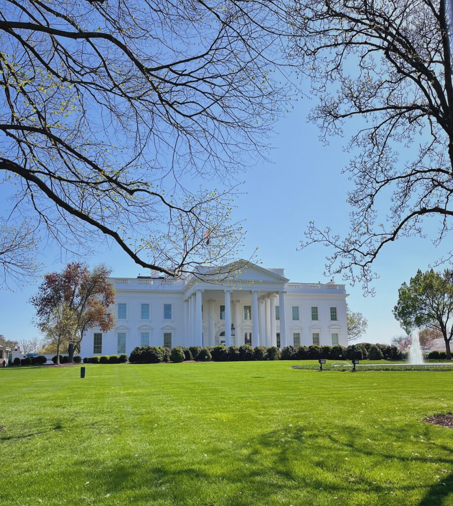 Front of the White House with green grass all around