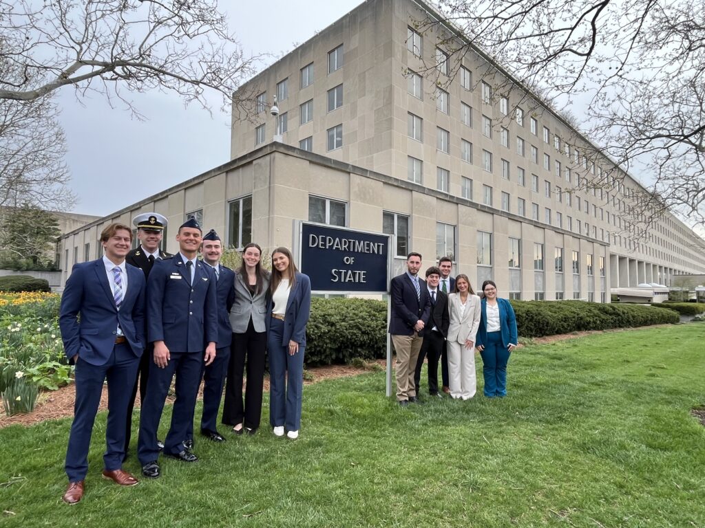 Natalie and students in front of the department of state