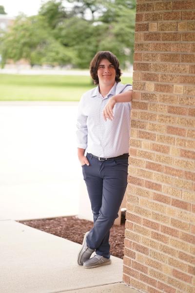 Miami University student Jack Waldvogel, a third-year Sport Communication and Media major with minors in Political Science and Journalism, stands outside of Miami building.