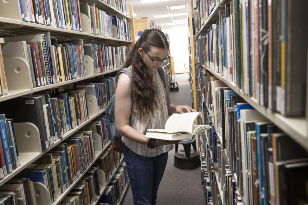 Miami University transfer student Em McGowan doing research a King Library.