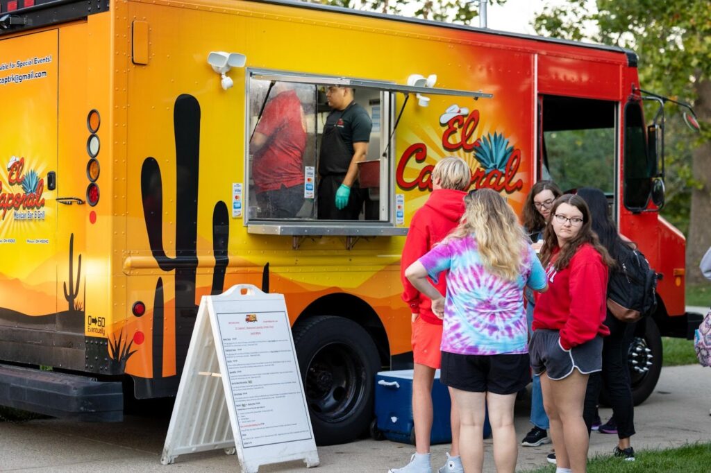 Families in line for food trucks.