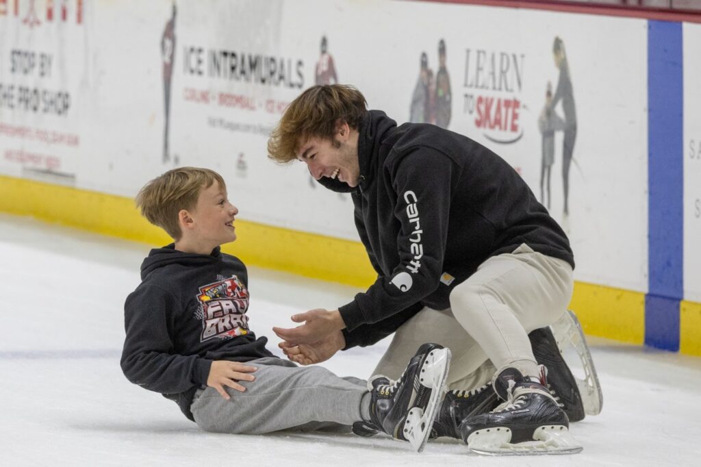 Family enjoying ice skating activities during Miami University Family Weekend. 