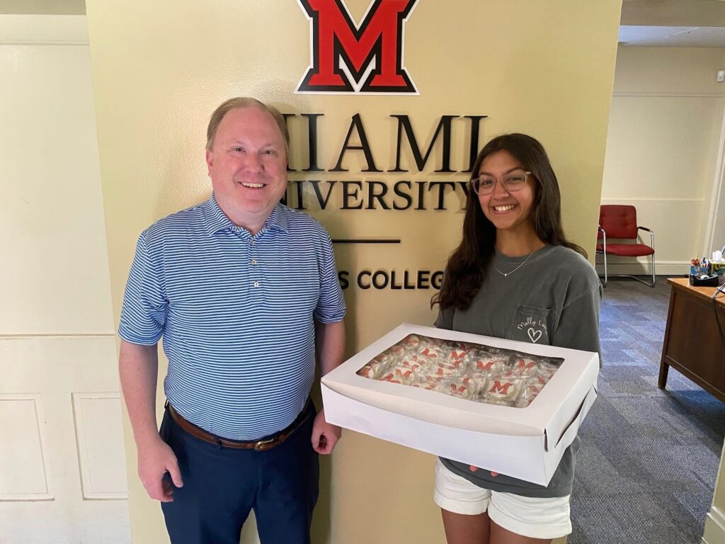 Molly Love and Zeb Baker, inaugural dean of the Miami University Honors College at the Honors Convocation, catered by Molly.