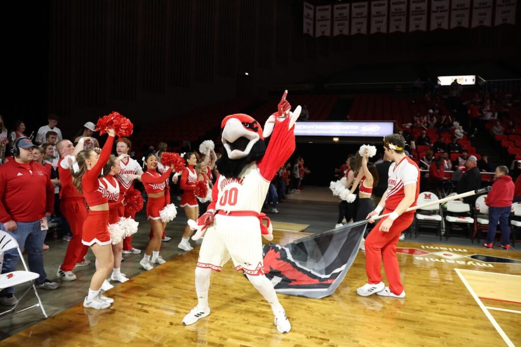 Miami University Swoop holding up his finger saying we're #1 during basketball game. 