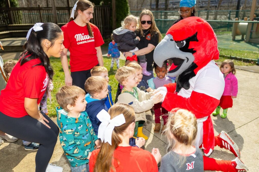 Miami University Swoop with cheerleaders meeting students at Mini U. 