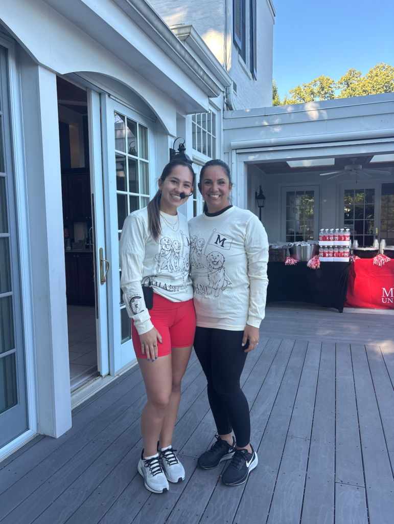 Miami University senior and M.O.V.E. Bootcamp instructor Bridget Stafford poses with her mom on Lewis Place who made a surprise visit. 