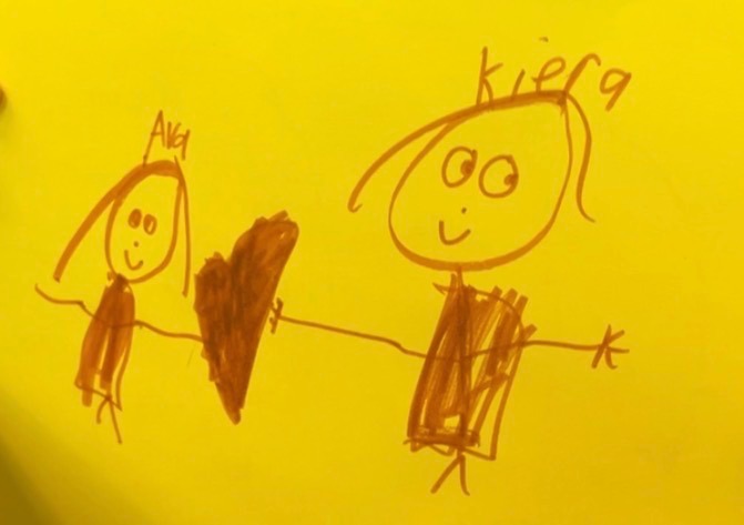 Drawing of kiers holding hands with a student, drawn by a student she taught in her program.