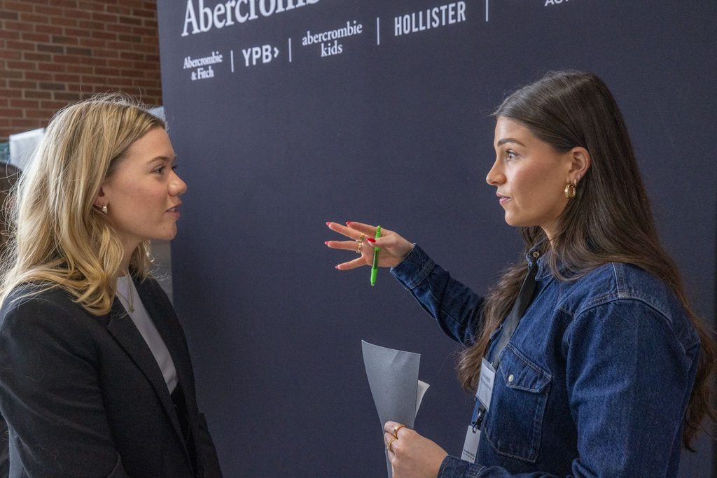 Miami University student speaking with an Abercrombie representative.